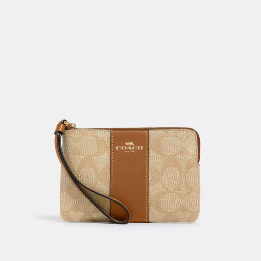 Coach Corner Zip Wristlet In Signature Canvas