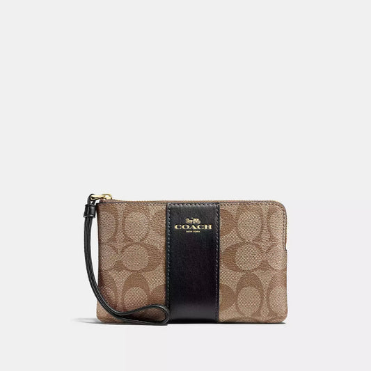 Coach Corner Zip Wristlet In Signature Canvas